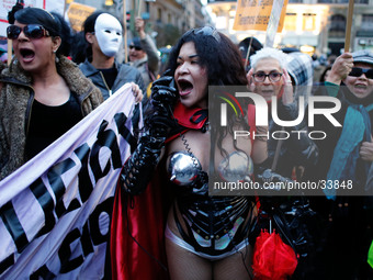 Protestors and prostitutes shout slogans during a protest against the criminalization of prostitution in Madrid, Spain, Saturday, Feb, 15th...