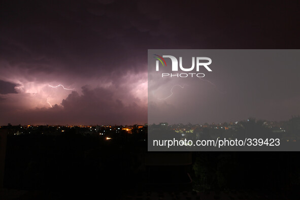 Lightning strikes on November 16, 2014 over the Gaza  town skyline during a thunderstorm early  