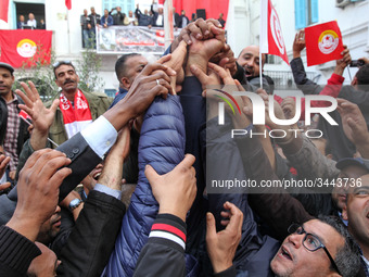 Unionists and workers rallied outside the headquarter of the Tunisian General Labour Union (UGTT), on November 17, 2018 in Tunis, where the...