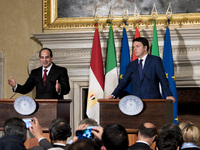 Egyptian President Abdel Fattah al-Sisi (L) and Italian Prime Minister Matteo Renzi shake hands during a news conference following their mee...