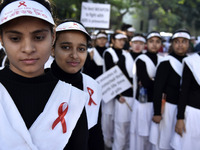 Social activists and nurses participate in an AIDS awareness rally organised by Assam State Aids Control society on the occasion of  World A...