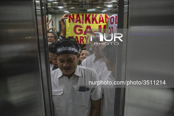 Jakarta, Indonesia, 04 December 2018 : Employee of Antara News Agency using elevator to the floor where they held the demonstration, which t...