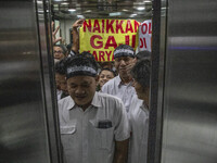Jakarta, Indonesia, 04 December 2018 : Employee of Antara News Agency using elevator to the floor where they held the demonstration, which t...