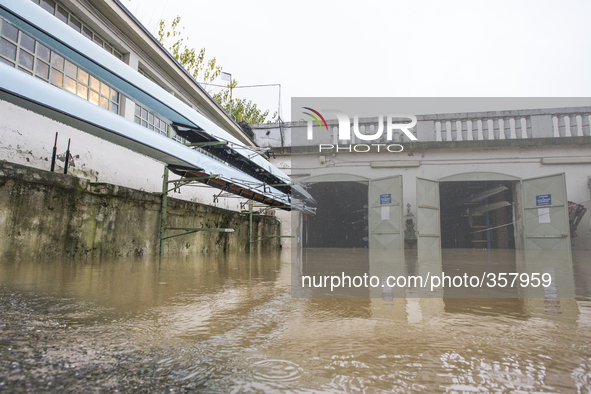 1st December Turin, Italy. The river Po in Turin flooding the rowing Club Armida  facing  the muddy waters  after 48 h of continuous rain. 