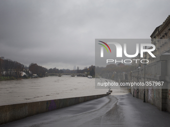 1st December Turin, Italy. The river Po flooding the Murazzi a pier, center of the night life of Turin, facing the muddy waters after 48 h o...