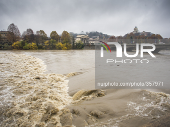 1st December Turin, Italy. The strong current create waves of muddy waters of Po river in the Turin center after 48 h of continuous rain. (
