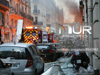 Firefighters respond the scene after A huge blast destroyed buildings and left casualties in French capital Paris on January 12, 2019. (