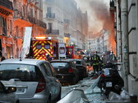 Firefighters respond the scene after A huge blast destroyed buildings and left casualties in French capital Paris on January 12, 2019. (