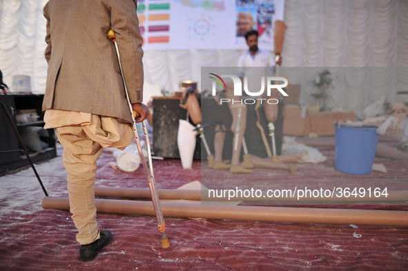 70yrs old Sher Bahadur Mahadev observes newly Artificial Limb to be fitted to Nepalese people during Artificial limb fitment camp in Norvic...