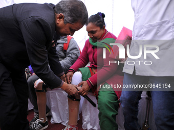Dignitaries present artificial limbs to beneficiaries during Artificial limb fitment camp in Norvic International Hospital, Kathmandu, Nepal...