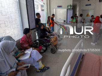 Medical personnel carry out service activities to patients at Anutapura Hospital, Palu, Central Sulawesi, Indonesia, Friday, January 25, 201...