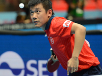 Tang Peng of Hong Kong serves during Men's single of the 2014 ITTF World Tour Grand Finals at Huamark Indoor Stadium on December 12, 2014 in...