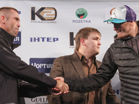 KIEV, UKRAINE - DECEMBER 12, 2014: World heavyweight boxing champion, Olympic champion Oleksandr
 Usyk(R) - Ukraine and Danie Venter(L) - So...