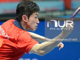 Wong Chun Ting of Hong Kong in actions during men's single of the 2014 ITTF World Tour Grand Finals at Huamark Indoor Stadium on December 12...
