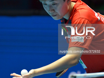 Feng Tianwei of Singapore serves during Women's single quarter final round of the 2014 ITTF World Tour Grand Finals at Huamark Indoor Stadiu...