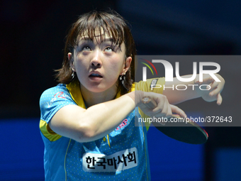 Seo Hyowon of South Korea serves during Women's single quarter final round of the 2014 ITTF World Tour Grand Finals at Huamark Indoor Stadiu...