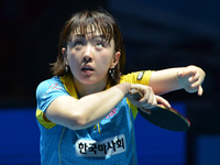 Seo Hyowon of South Korea serves during Women's single quarter final round of the 2014 ITTF World Tour Grand Finals at Huamark Indoor Stadiu...