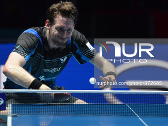 in actions during Men's single quarter final round of the 2014 ITTF World Tour Grand Finals at Huamark Indoor Stadium on December 13, 2014 i...