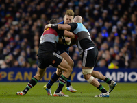 Leinster’s Ian Madigan (Center) in action challenged by Harlequins’ George Robson (Right) and Nick Easter (Left), during Leinster Rugby vs H...