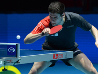 Dimitri Ovtcharov of Germany in actions during Men's single semi-final round of the 2014 ITTF World Tour Grand Finals at Huamark Indoor Stad...
