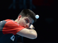Dimitri Ovtcharov of Germany serves during Men's single semi-final round of the 2014 ITTF World Tour Grand Finals at Huamark Indoor Stadium...