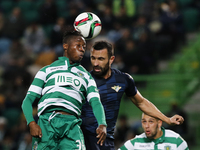 Sporting's forward Carlos Mane (L) heads for the ball with Moreirense's defender Marcelo Oliveira (R)  during the Portuguese League  footbal...