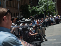 AUSTRALIA, Sydney: Office workers are evacuated from a building as parts of Sydney's central business district remain closed following a hos...
