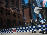 AUSTRALIA, Sydney: Office workers are evacuated from a building as parts of Sydney's central business district remain closed following a hos...