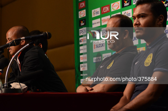 Malaysia coach Dollah Salleh (2-R) and Safee Sali (1-R) attends a press conference of the AFF Suzuki Cup 2014 final round 1st leg Thailand v...