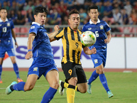 Norshahrul Idlan Talaha of Malaysia #9 is close down by Thailand player during the AFF Suzuki Cup 2014 final round 1st leg Thailand - Malays...