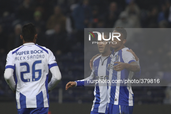 PORTUGAL, Porto: Porto's Brazilian defender Danilo Silva (R) celebrates with teammate Porto's Brazilian midfielder Evandro (L) after scoring...