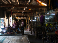 Weavers is weaving inside a handloom factory on  December 21, 2014 in Pabna, Bangladesh. 
Bangladesh has a glorious long tradition of her h...