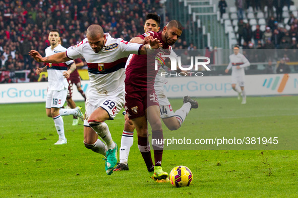 Genoa midfielder Stefano Sturaro (69) fights for the ball against Torino defender Bruno Peres (33) during the Serie A football match n.16 TO...