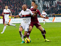 Genoa midfielder Stefano Sturaro (69) fights for the ball against Torino defender Bruno Peres (33) during the Serie A football match n.16 TO...