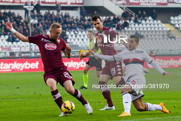 Torino defender Kamil Glik (25) fights for the ball against Genoa forward Iago Falque (24) during the Serie A football match n.16 TORINO - G...