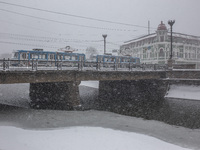 Tram crosses Lopan bridge, in Kharkov, Ukraine, on December 28, 2014. (