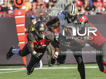 Tampa Bay Buccaneers free safety Keith Tandy (37) intercepts a pass intended for New Orleans Saints wide receiver Marques Colston (12) durin...
