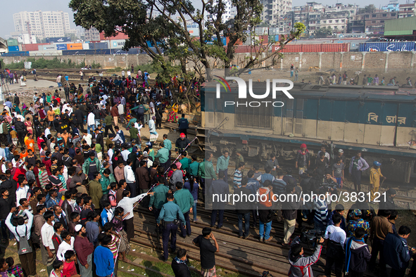 Hundreds gathered at the accident site on December 28, 2014 in Dhaka, Bangladesh. 