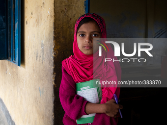 A small girl namely Chandni, studies in class two at a primary school close to Ship Breaking/Building yard in Keraniganj, Dhaka, Bangladesh...