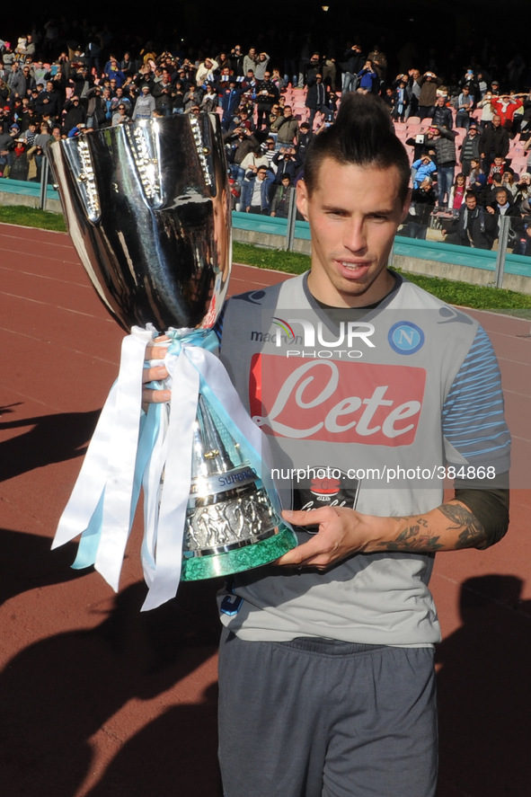 SSC napoli Marek Hamsik poses with the Supercoppa during training and presentation on Supercup Supercoppa won in Doha at San Paolo Stadium o...