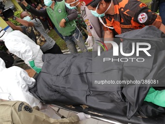 Imanudin hospital at pangkalan bun-kalimantan prepares the coffin for the victim of air asia plane crash. The Search and resque team who del...