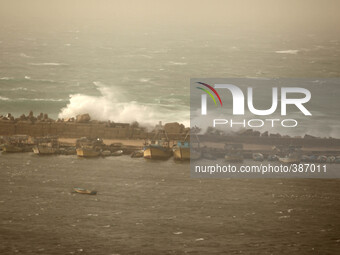Large waves from rough seas collide with the break wall at the Gaza seaport in Gaza City on January 6, 2015, during a winter storm.  (