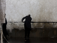 A storm makes its way across Israel, with strong winds, rain, and snow fall in parts of the country.A person watches as waves crash on the M...
