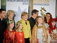 German Chancellor Angela Merkel receives child Epiphany carolers from across Germany at the Chancellery on January 7, 2015 in Berlin, German...