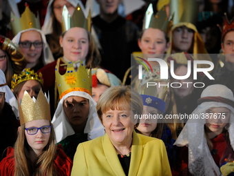 German Chancellor Angela Merkel receives child Epiphany carolers from across Germany at the Chancellery on January 7, 2015 in Berlin, German...