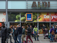 People walking by the Aldi supermarket in central Manchester. (