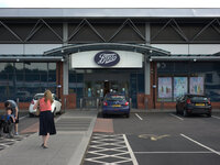 A person approaching Boots, the UK pharmacy and beauty chain, in central Stockport. (