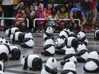 Visitors tlook at panda sculptures during the 1,600 Pandas World Tour at National Monument in Kuala Lumpur, Malaysia on January  9, 2015. Th...