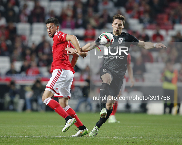 Benfica's midfielder Andreas Samaris (L) vies for the ball with Guimaraes's forward Tomane (R)  during the Portuguese League  football match...