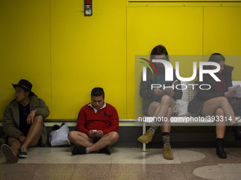 Participants wait for the underground during the 6th edition of 